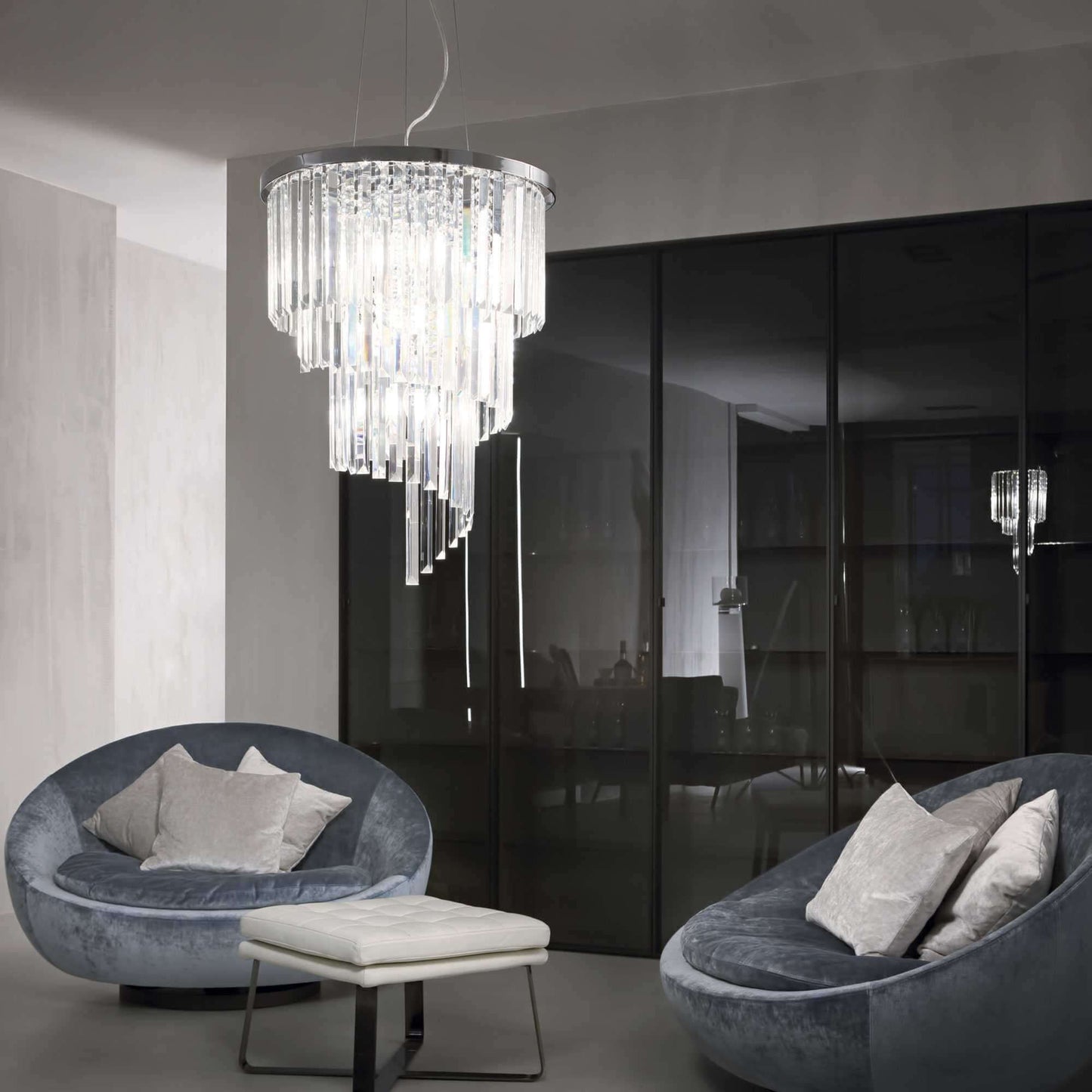 Chrome and clear crystal waterfall chandelier in living room